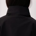 Lolë Alizé Short Trench Coat in black — fit note: Cut with a relaxed fit for comfortable layering