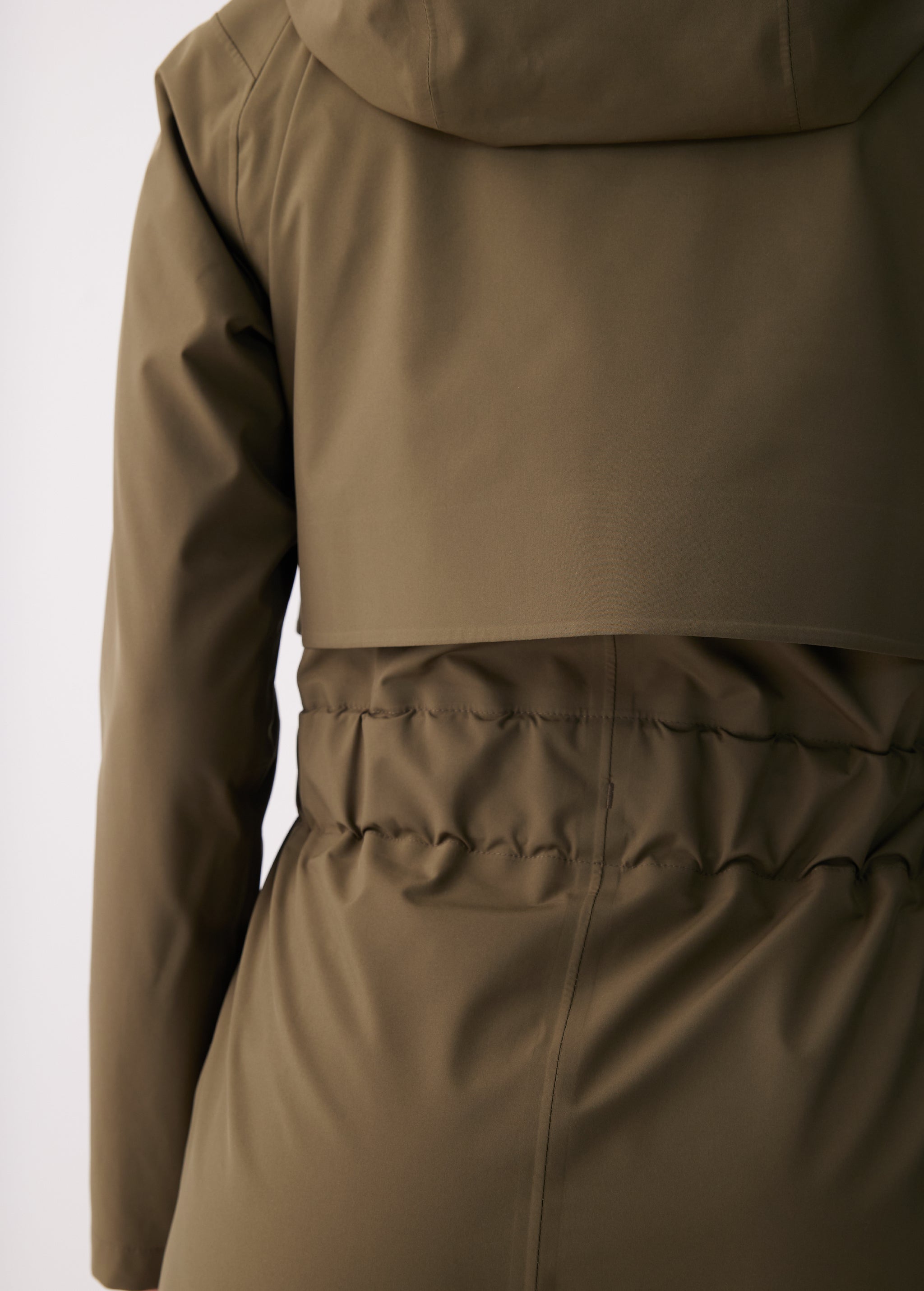 Lolë Alizé Short Trench Coat in Moss olive green — fit note: Cut with a relaxed fit for comfortable layering