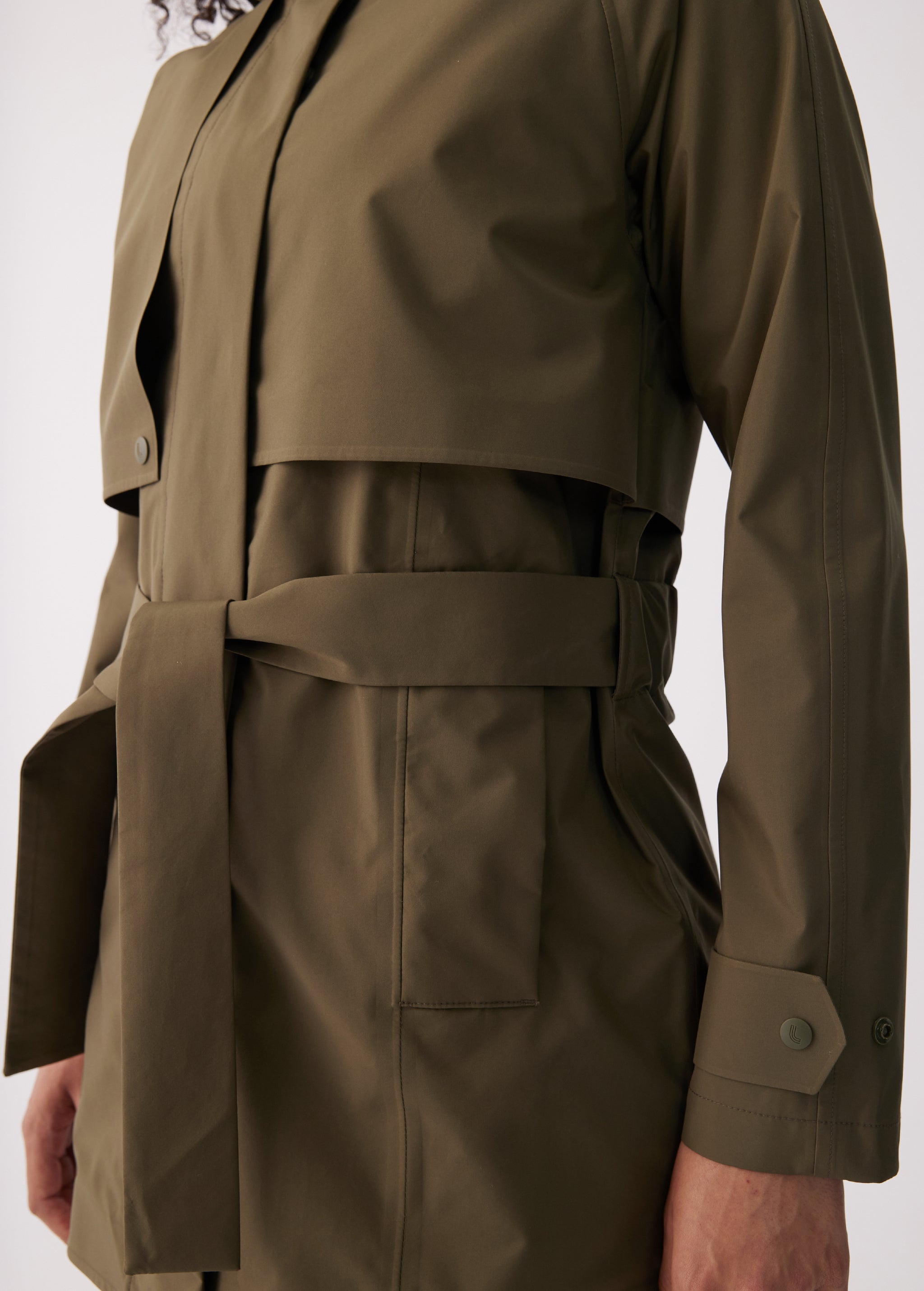 Lolë Alizé Short Trench Coat in Moss olive green — fit note: Cut with a relaxed fit for comfortable layering