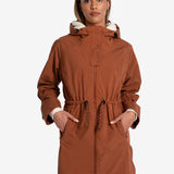 Lolë Piper Oversized Rain Jacket in rust — for a more streamlined fit, consider sizing down