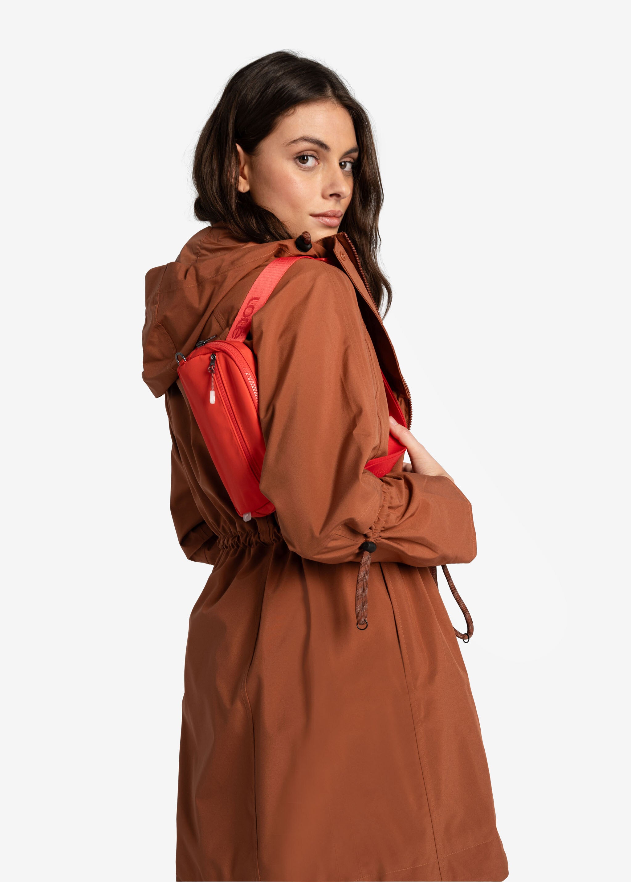 Lolë Piper Oversized Rain Jacket in rust — for a more streamlined fit, consider sizing down