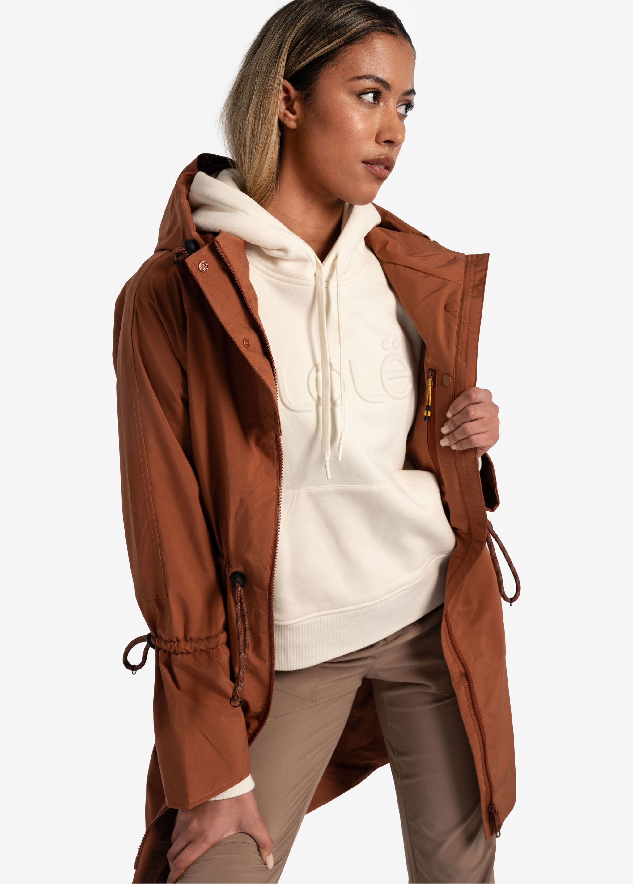 Lolë Piper Oversized Rain Jacket in rust — for a more streamlined fit, consider sizing down