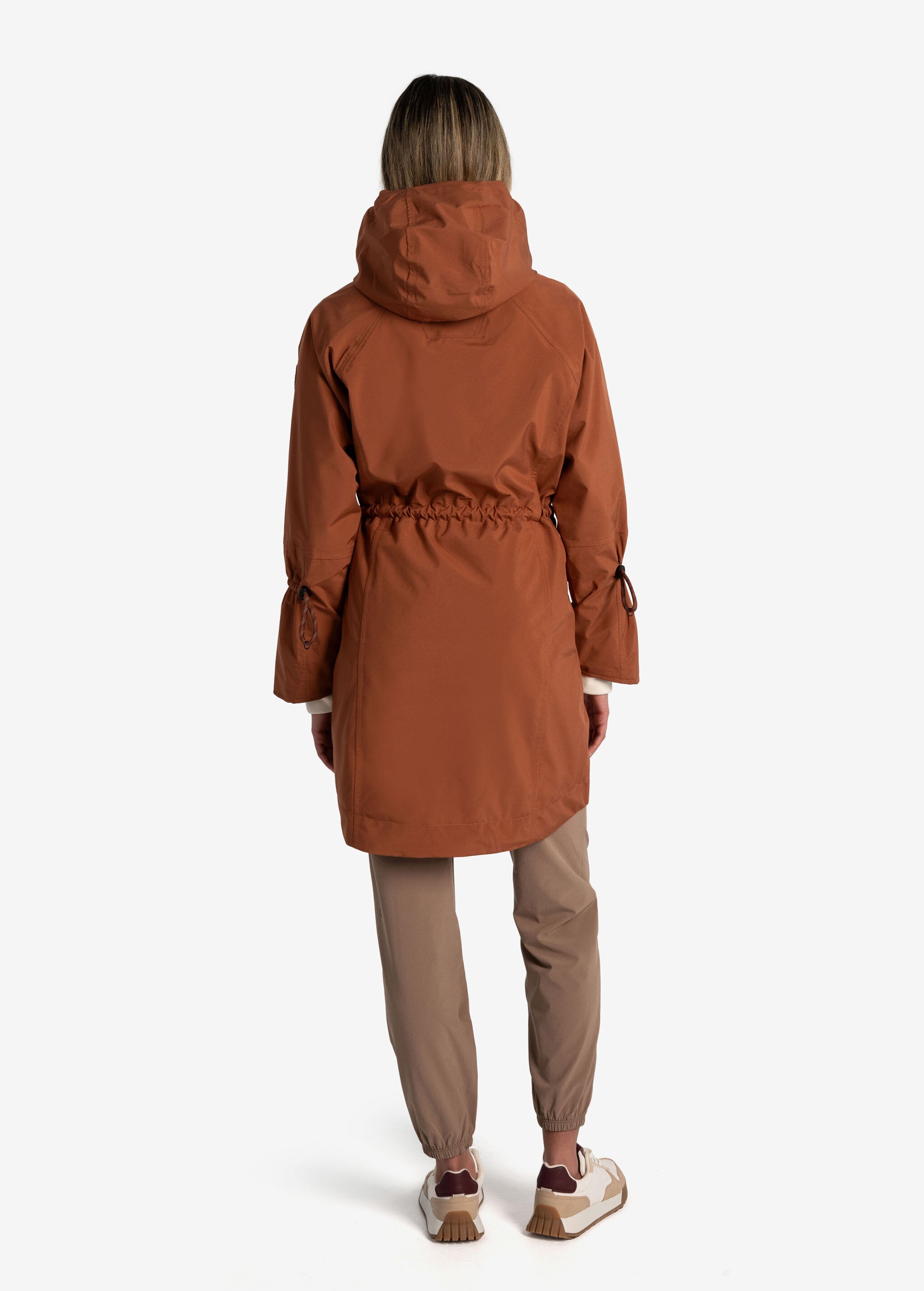 Lolë Piper Oversized Rain Jacket in rust — for a more streamlined fit, consider sizing down