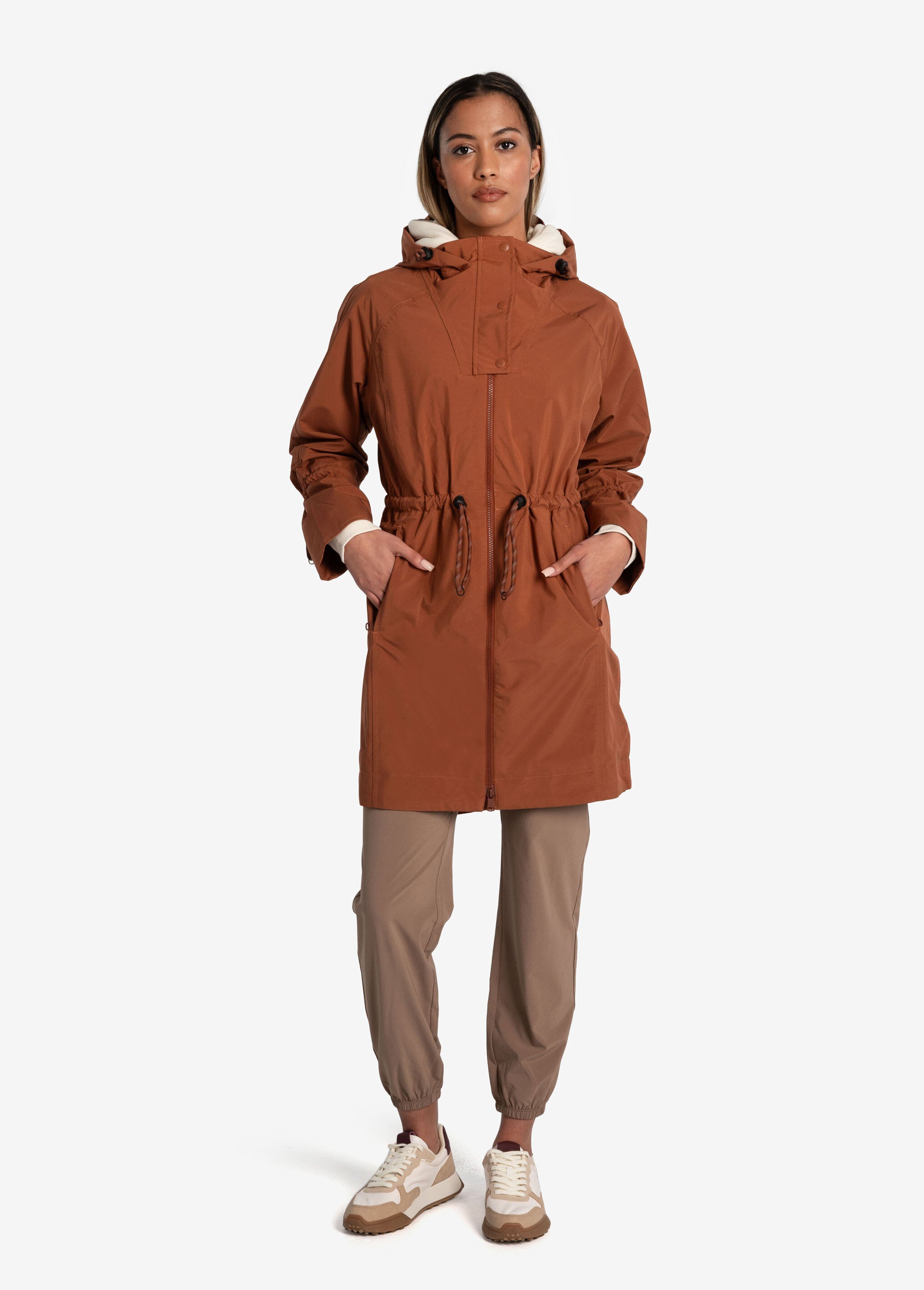 Lolë Piper Oversized Rain Jacket in rust — for a more streamlined fit, consider sizing down