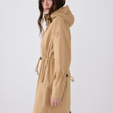 Lolë Piper Oversized Rain Jacket in Carmel tan — for a more streamlined fit, consider sizing down