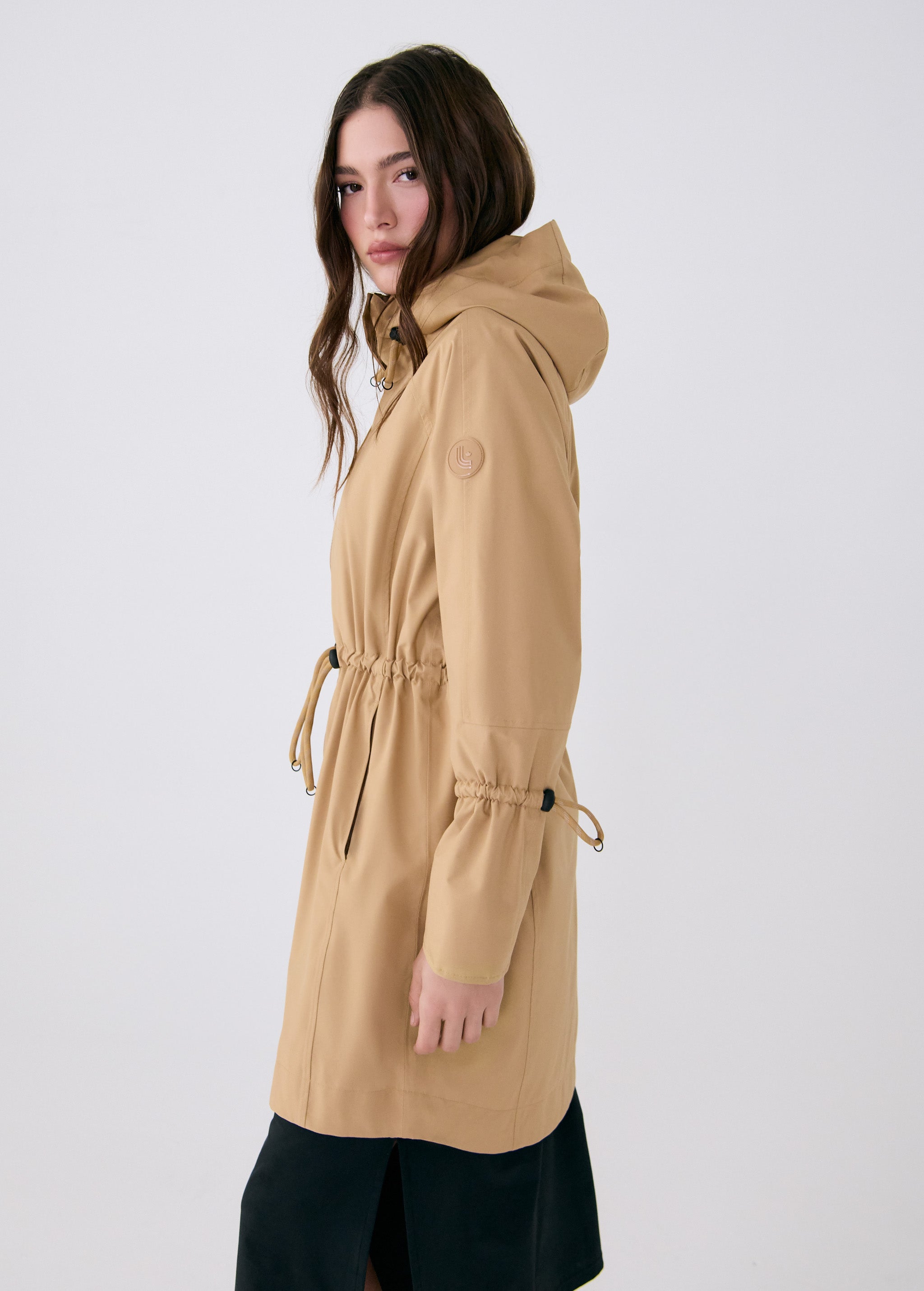 Lolë Piper Oversized Rain Jacket in Carmel tan — for a more streamlined fit, consider sizing down