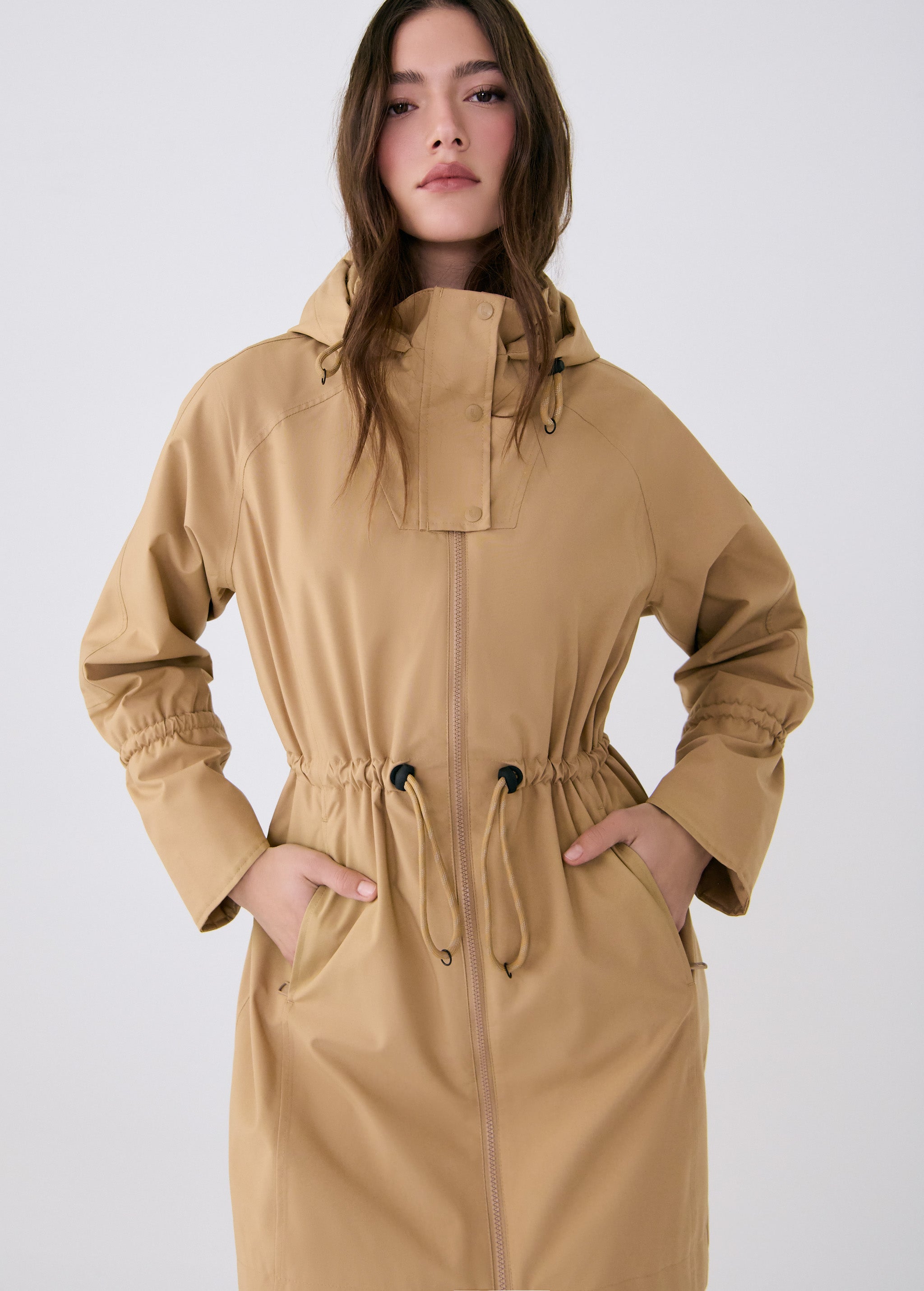Lolë Piper Oversized Rain Jacket in Carmel tan — for a more streamlined fit, consider sizing down