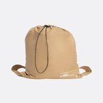 Lolë Piper Oversized Rain Jacket in Carmel tan — for a more streamlined fit, consider sizing down