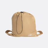 Lolë Piper Oversized Rain Jacket in Carmel tan — for a more streamlined fit, consider sizing down