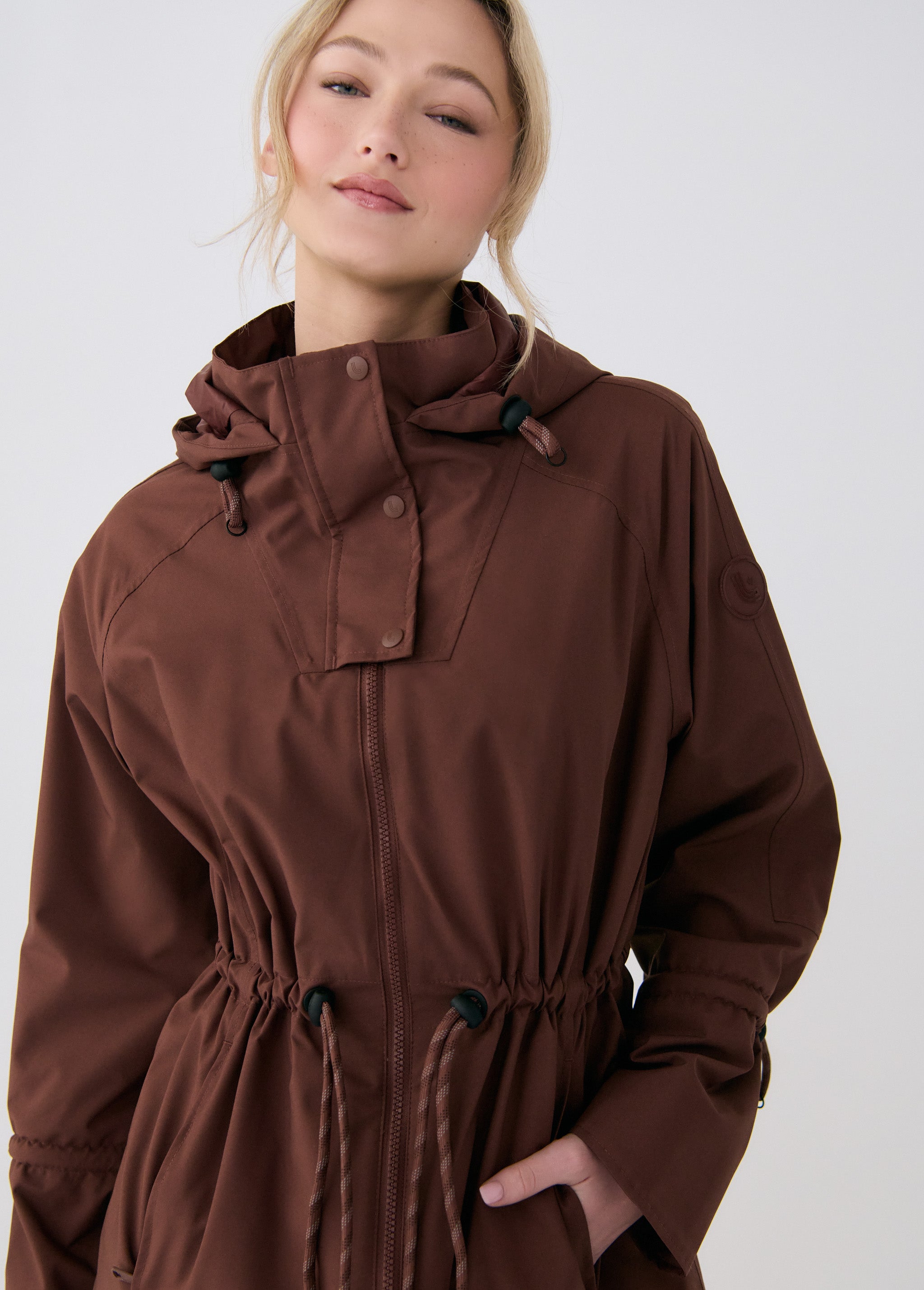 Lolë Piper Oversized Rain Jacket in Sienna brown — for a more streamlined fit, consider sizing down