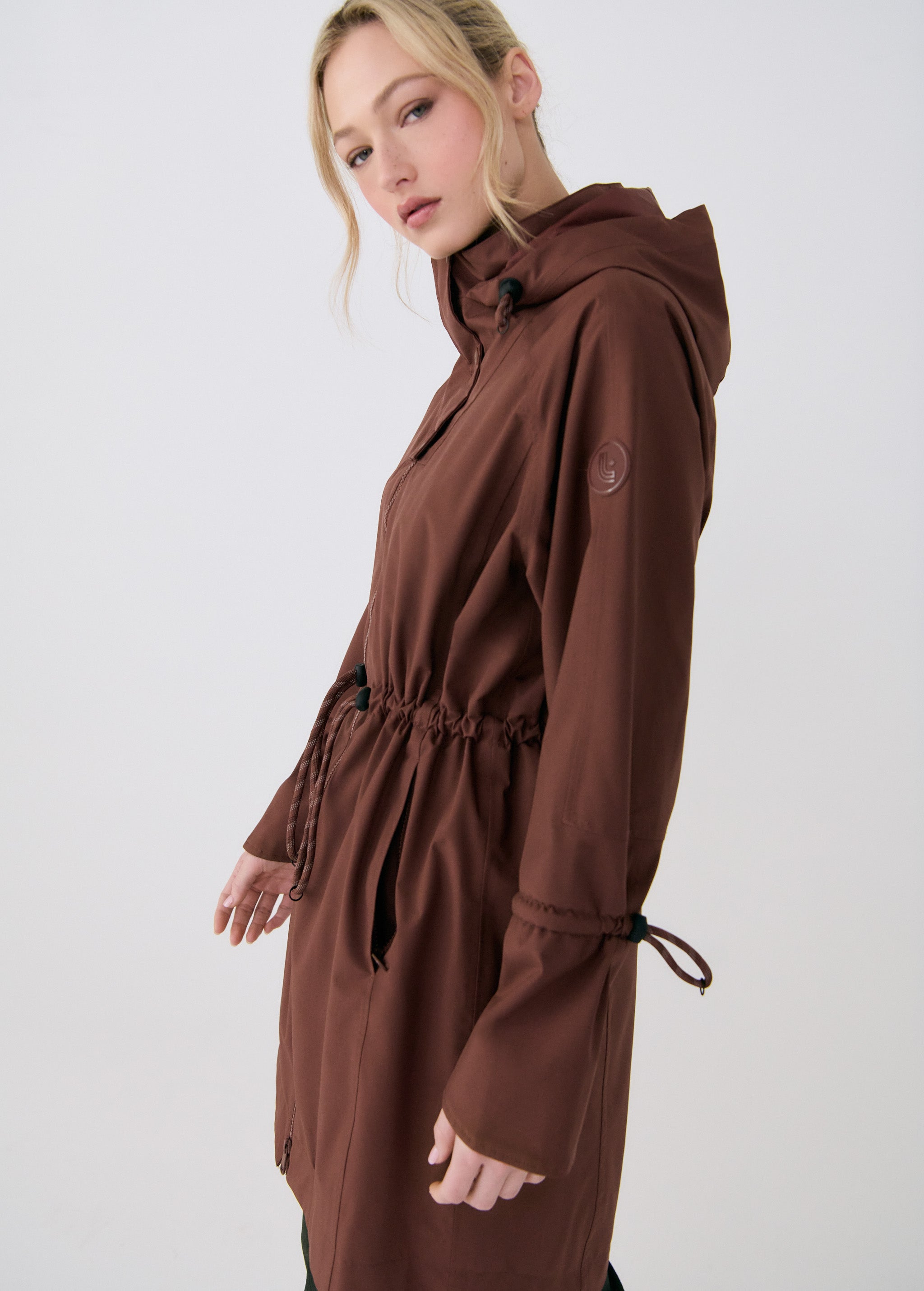 Lolë Piper Oversized Rain Jacket in Sienna brown — for a more streamlined fit, consider sizing down