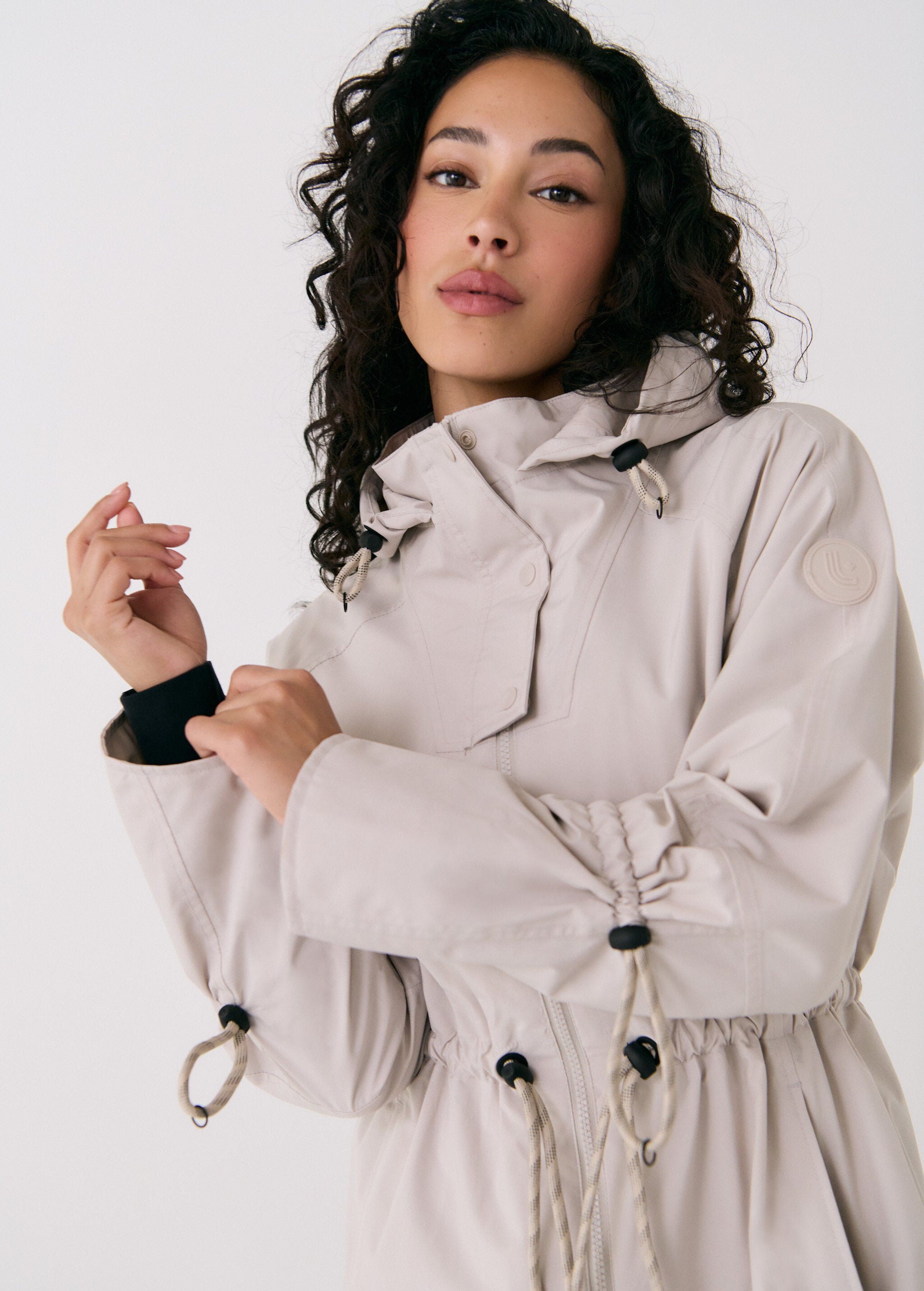 Lolë Piper Oversized Rain Jacket in Abalone pale greige — for a more streamlined fit, consider sizing down