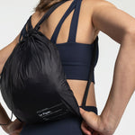 Lolë Piper Oversized Rain Jacket in black — for a more streamlined fit, consider sizing down