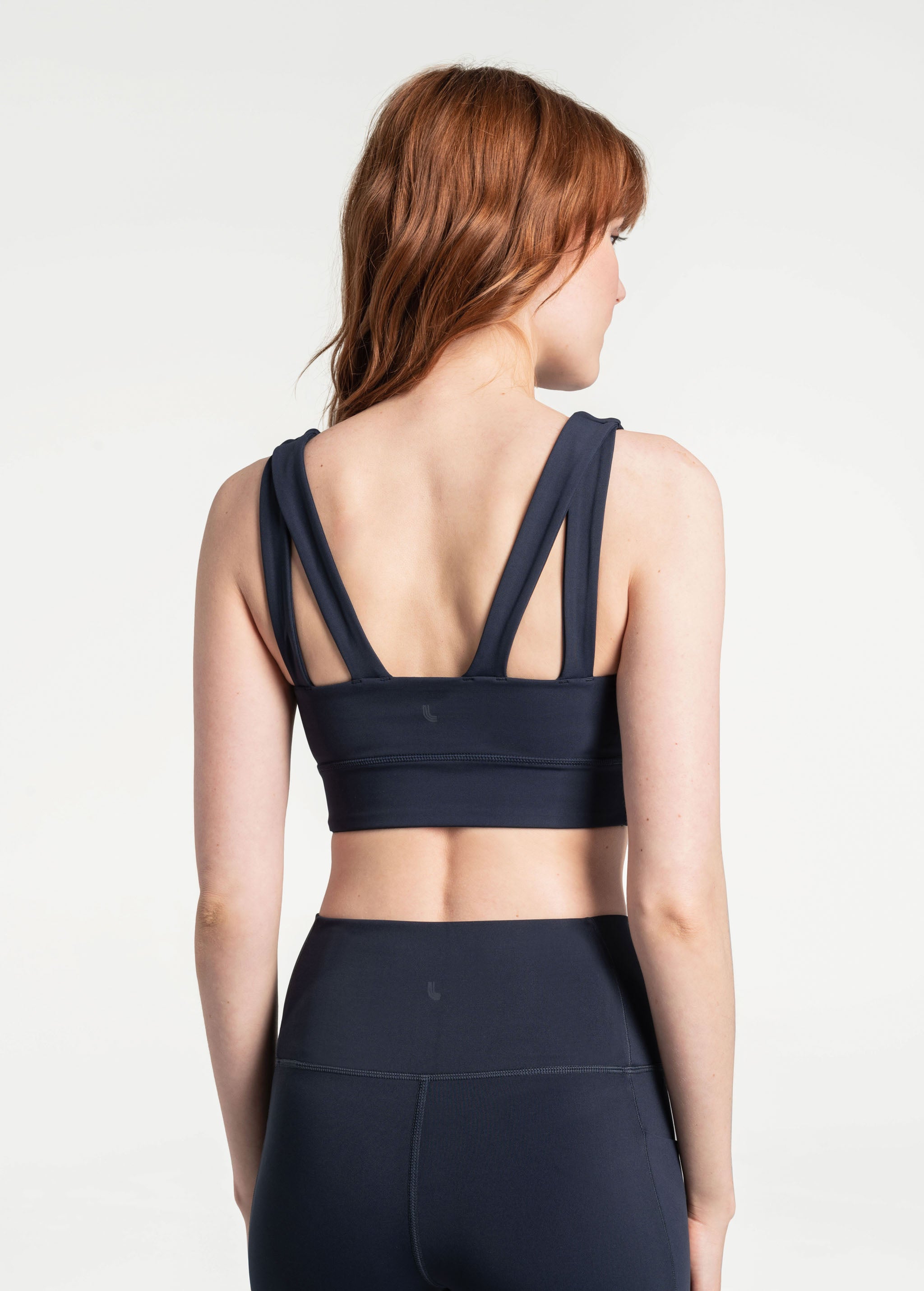 Lolë Step Up Bra in Outerspace navy — this high-support longline sports bra sets you in motion