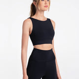 Lolë Step Up Bra in black — this high-support longline sports bra sets you in motion