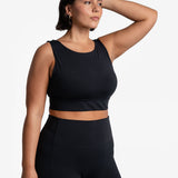Lolë Step Up Bra in black — this high-support longline sports bra sets you in motion