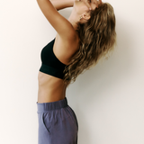 Lolë Power Sport Bra in black — a thick branded strap and hook-and-eye closure serve maximum support