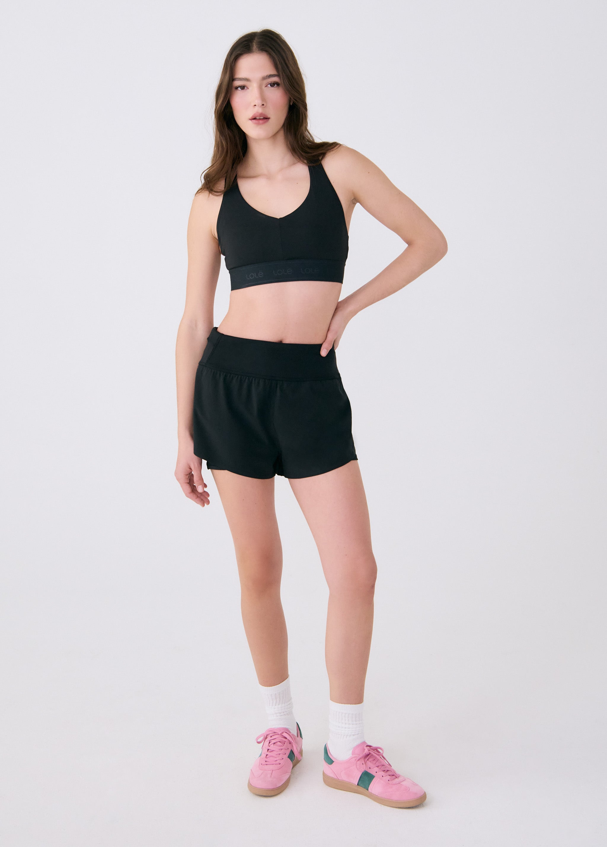 Lolë Power Sport Bra in black — a thick branded strap and hook-and-eye closure serve maximum support