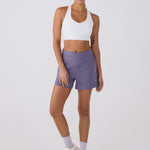 Lolë Power Sport Bra in white — a thick branded strap and hook-and-eye closure serve maximum support