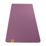 Lolë Pose yoga mat in orchid purple, unrolled flat showing the smooth orchid-purple top and small logo tab