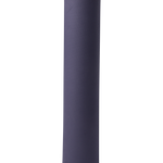 Lolë Pose yoga mat in navy, rolled and standing upright showing the herringbone-textured navy outer surface