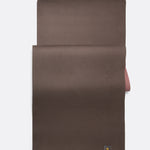 Lolë Pose yoga mat in chocolate brown, laid flat with the brown surface up and dusty rose underside at the edge
