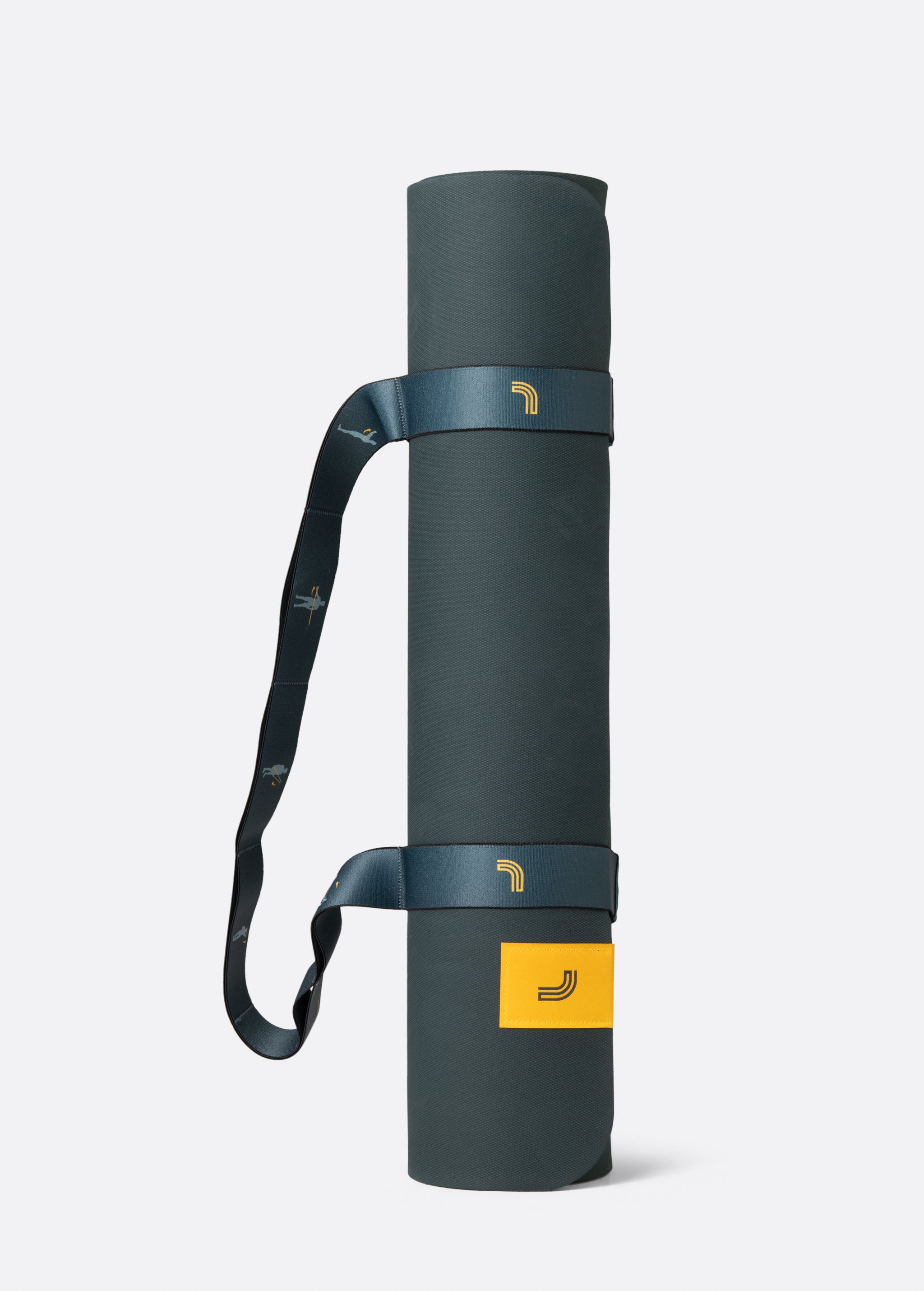 Lolë Pose yoga mat in dark teal, rolled up with the teal shoulder strap wrapped around it