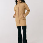 Lolë Element Long Rain Jacket in Carmel tan — shake off wet weather with this longline rain jacket