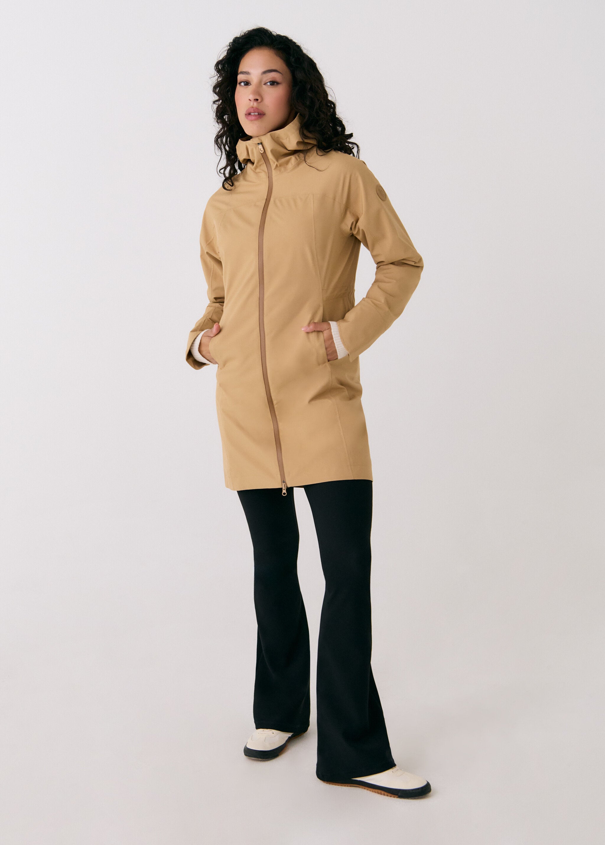 Lolë Element Long Rain Jacket in Carmel tan — shake off wet weather with this longline rain jacket