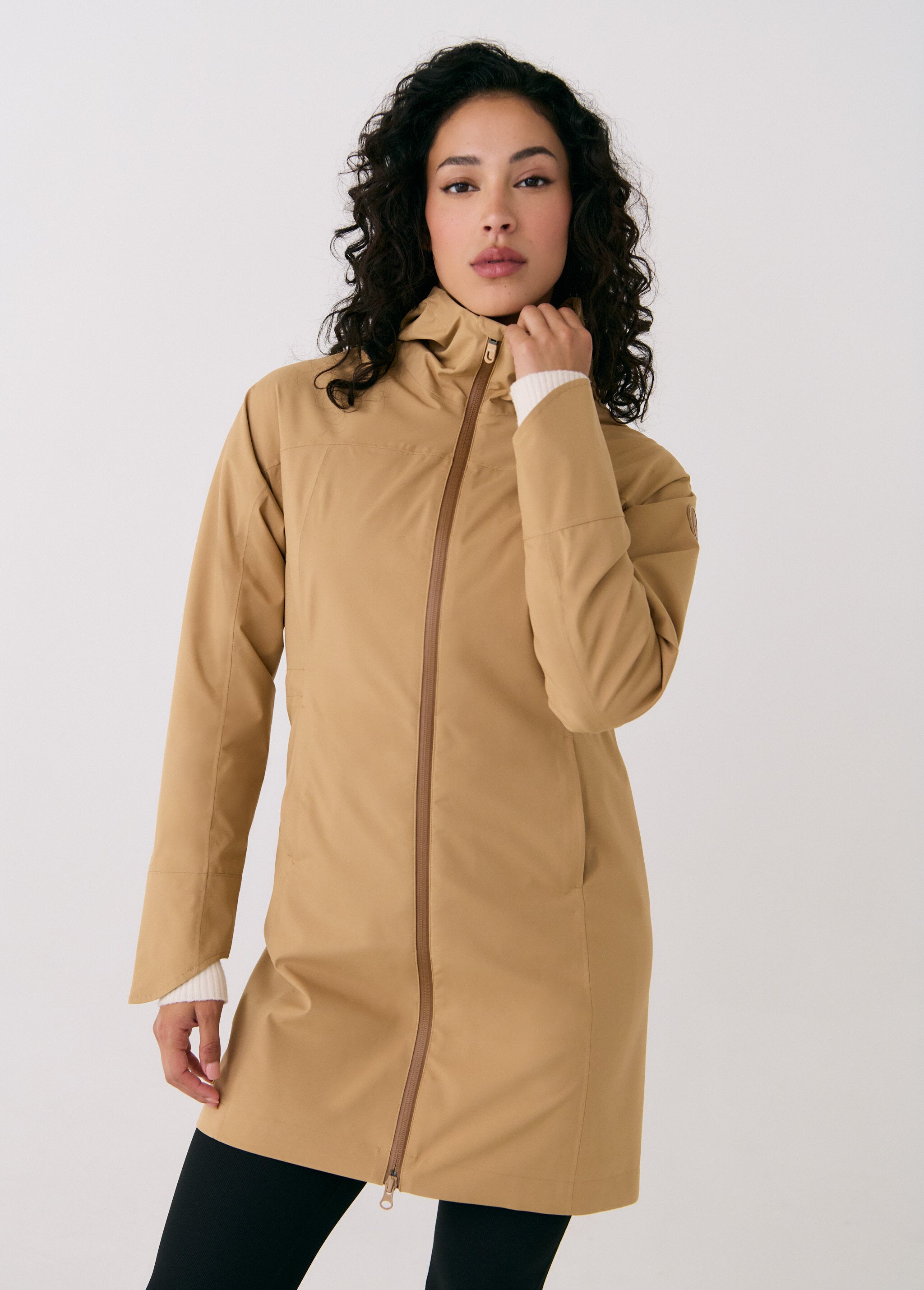Lolë Element Long Rain Jacket in Carmel tan — shake off wet weather with this longline rain jacket