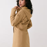 Lolë Element Long Rain Jacket in Carmel tan — shake off wet weather with this longline rain jacket