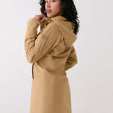 Lolë Element Long Rain Jacket in Carmel tan — shake off wet weather with this longline rain jacket