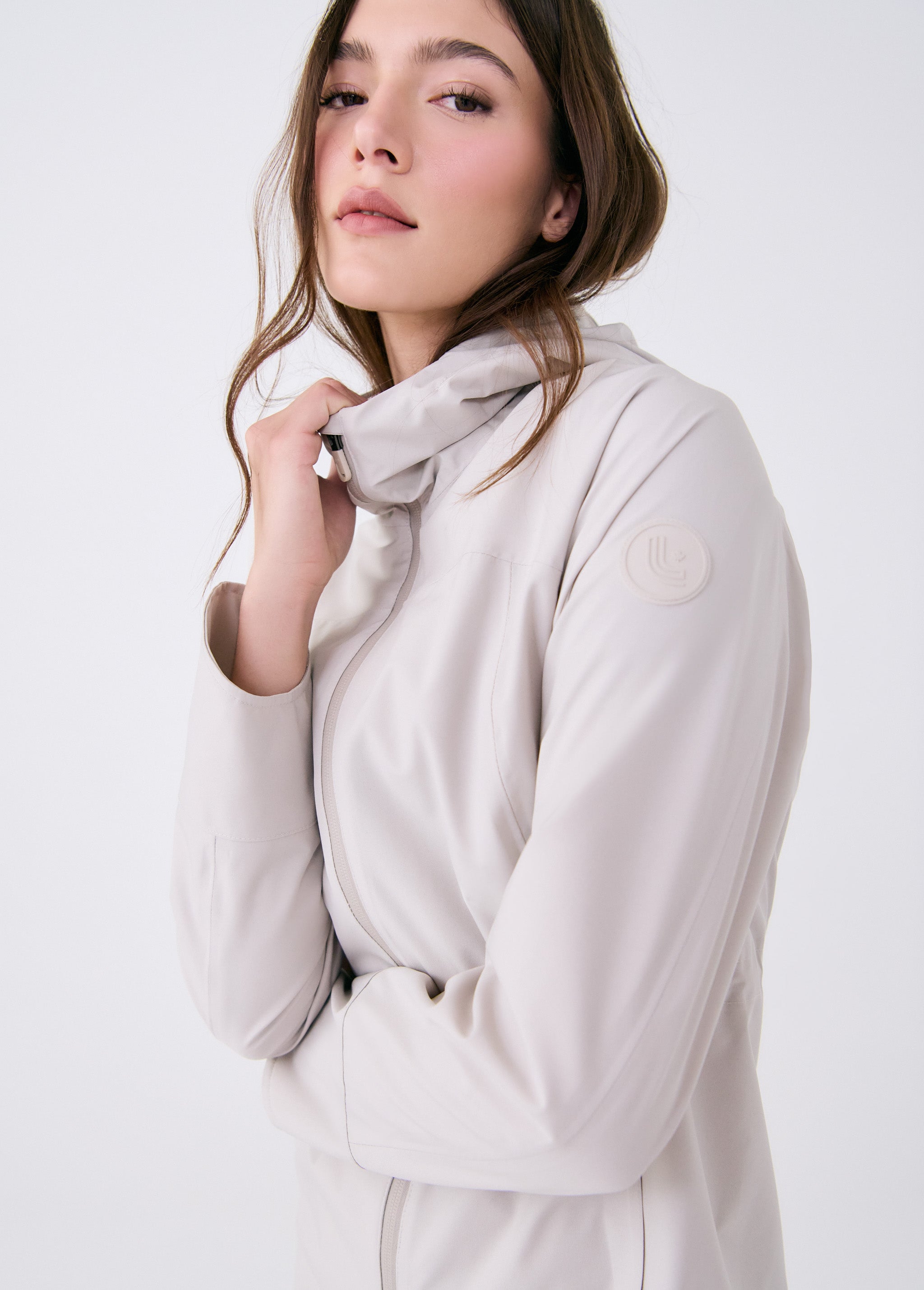 Lolë Element Long Rain Jacket in Abalone pale greige — shake off wet weather with this longline rain jacket