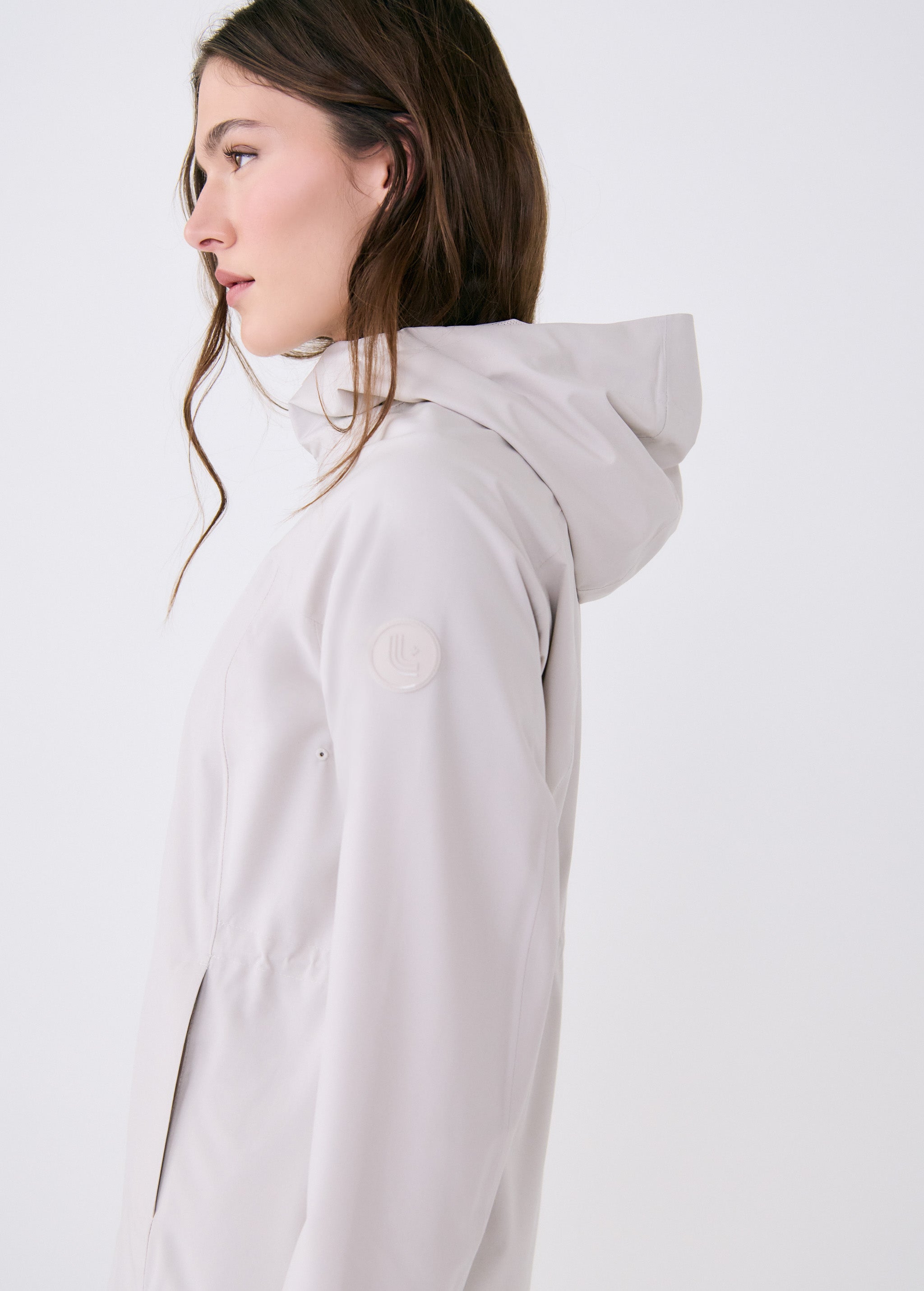 Lolë Element Long Rain Jacket in Abalone pale greige — shake off wet weather with this longline rain jacket