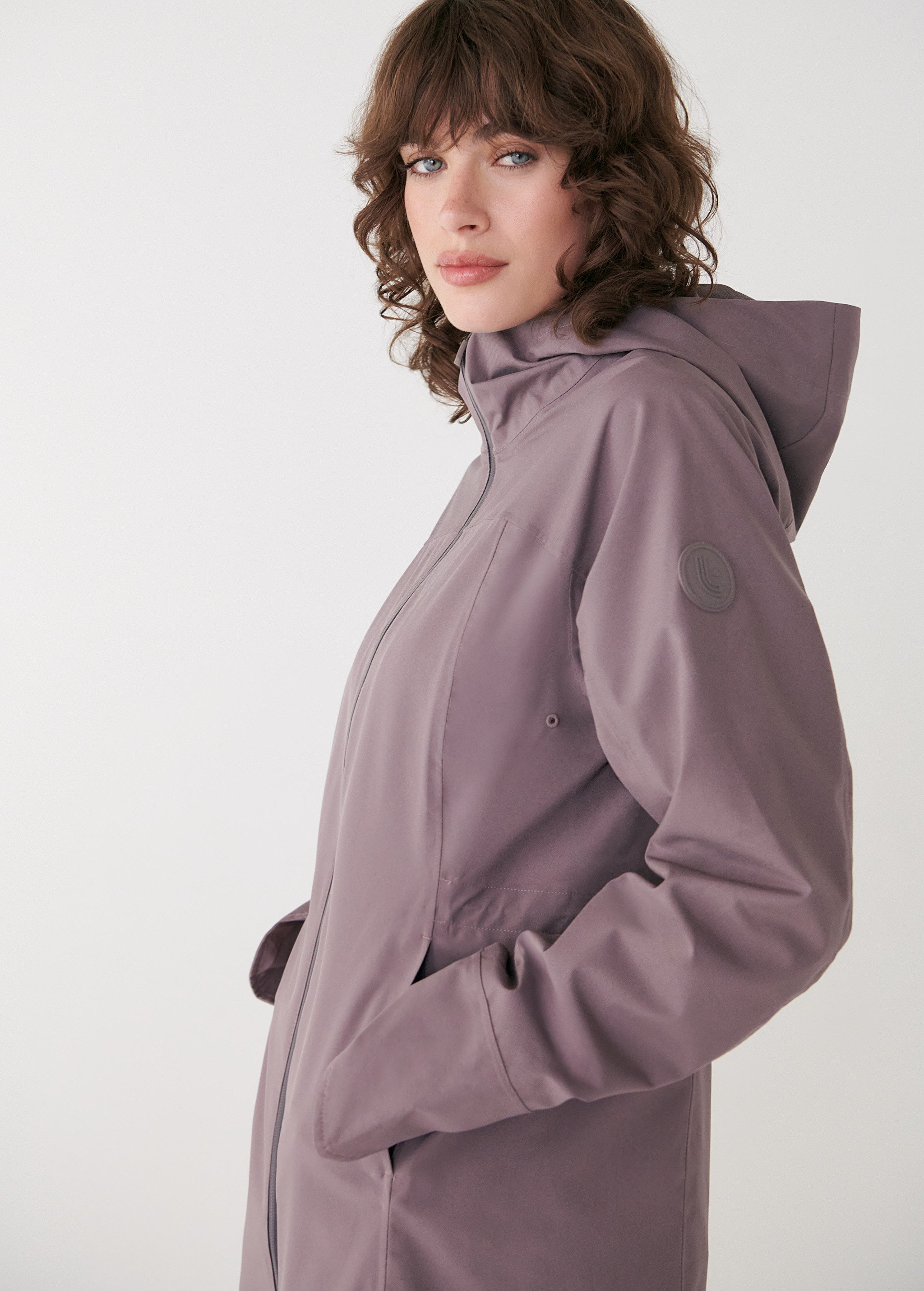 Lolë Element Long Rain Jacket in Twilight mauve taupe — shake off wet weather with this longline rain jacket