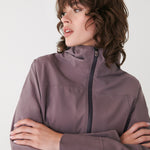 Lolë Element Long Rain Jacket in Twilight mauve taupe — shake off wet weather with this longline rain jacket