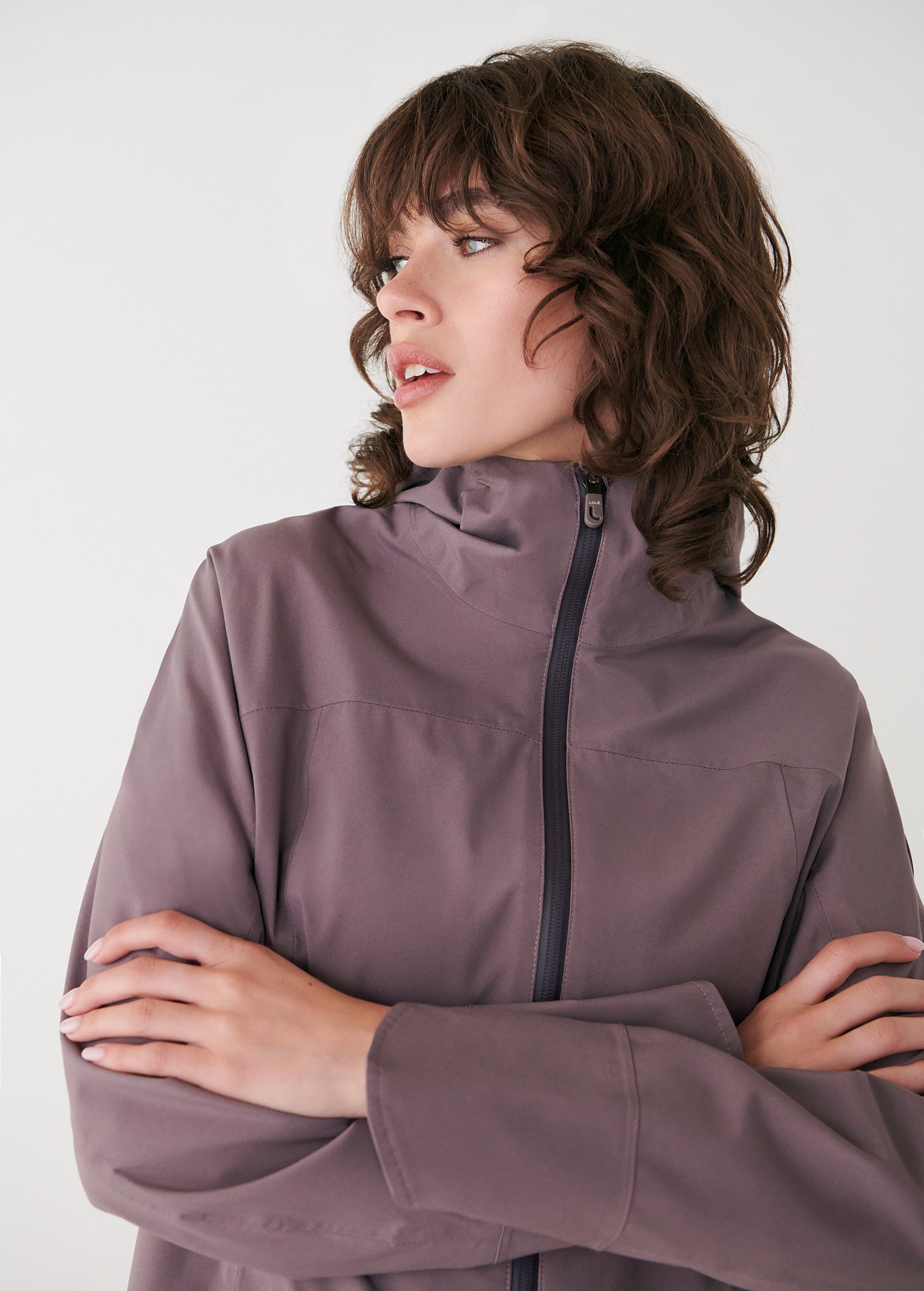 Lolë Element Long Rain Jacket in Twilight mauve taupe — shake off wet weather with this longline rain jacket