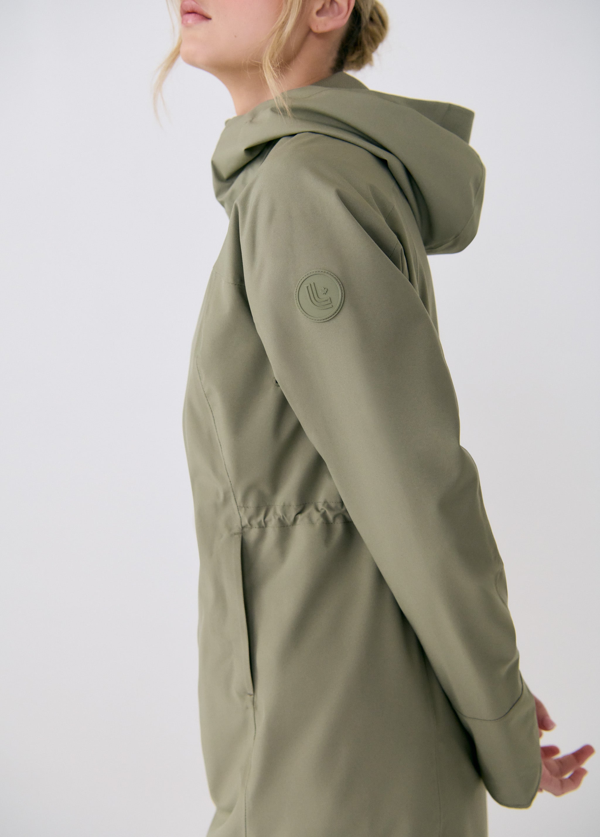 Lolë Element Long Rain Jacket in Hazel sage green — shake off wet weather with this longline rain jacket